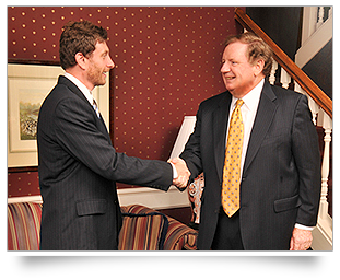 Photo of Robert Stripling and client shaking hands
